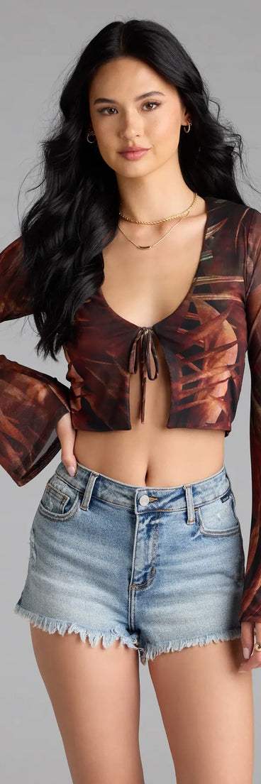 With its midriff cut and trend-forward fit, the Getaway Vibe Tropical Print Tie-Front Top is a multi-color crop top made to pair with skirts, denim, or whatever vibe you're feeling this season.