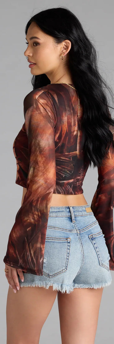 For college campus looks, game day outfits, or a bold going-out vibe, the Getaway Vibe Tropical Print Tie-Front Top is an on-trend multi-color crop top that easily styles with your favorite denim.