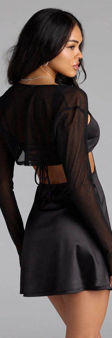 Add the perfect finish with the Party Glow Glitter Mesh Bolero, a black bolero that refines your look with effortless charm.