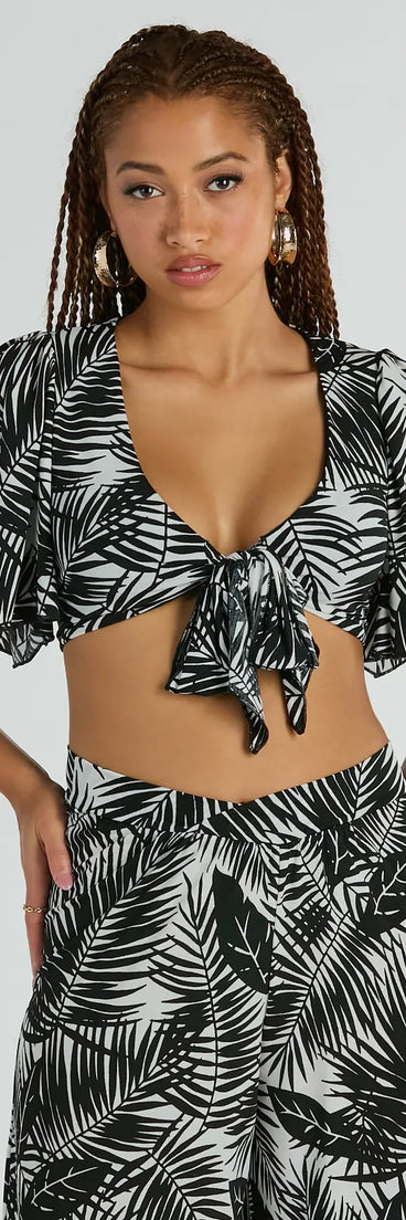 The Time For Vacay Tie Front Tropical Crop Top in black with a modern design and trendy look is part of the latest women's tops collection to elevate your 2025 wardrobe.