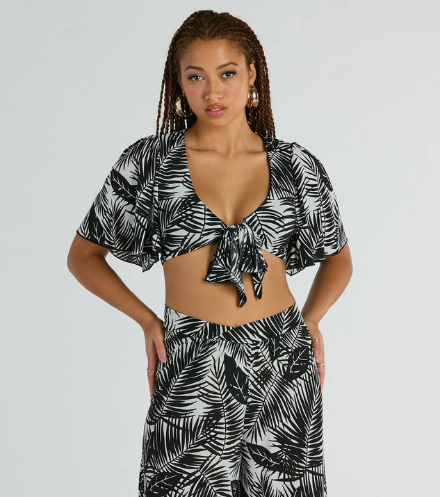 The Time For Vacay Tie Front Tropical Crop Top in black with a modern design and trendy look is part of the latest women's tops collection to elevate your 2025 wardrobe.