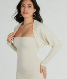She's The Main Rib Knit Slouchy Bolero, a trendy ivory addition to women's going-out outfits, is ideal for Christmas party outfits, chic NYE attire, or winter night-out looks that keep you on-trend!