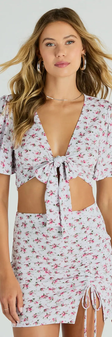 Effortlessly create holiday party outfits or vacation-ready looks with the Sweet Flirt Flutter-Sleeve Ditsy Floral Tie-Front Top, one part of a versatile women's ivory matching set perfect for quick and easy outfit combinations from layering chic outfits to transitioning your look seamlessly.
