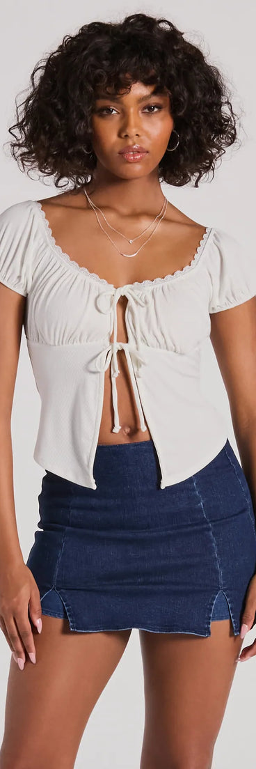 The Sultry Example Tie-Front Lace Trim Crop Top in white with a modern design and trendy look is part of the latest women's tops collection to elevate your 2025 wardrobe.