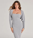 Wrap up in style with the She's The Main Rib Knit Slouchy Bolero, a cozy gray sweater for women designed for night-out looks, everyday outfits, or as a chic layering piece for the colder months.
