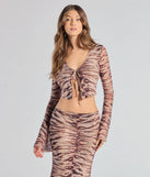 Serve effortless style and scroll-stopping energy in the Strut It Out Abstract Zebra Tie-Front Top, part of a brown matching clothing set that does the work for you with bold, polished vibes from top to bottom.