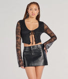From bold to effortless, the Caught Feels Tie Front Lace Crop Top lets you define your vibe with black tops that speak your style.