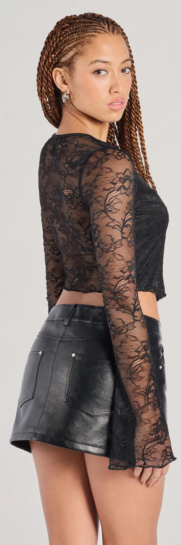 With its midriff cut and trend-forward fit, the Caught Feels Tie Front Lace Crop Top is a black crop top made to pair with skirts, denim, or whatever vibe you're feeling this season.