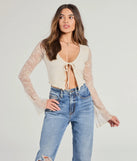 Stay on-trend this season with the Soft And Sweet Tie-Front Split Lace Crop Top in ivory, a must-have for creating stylish and effortless spring outfits for women.