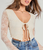 Stay on-trend this season with the Soft And Sweet Tie-Front Split Lace Crop Top in ivory, a must-have for creating stylish and effortless spring outfits for women.