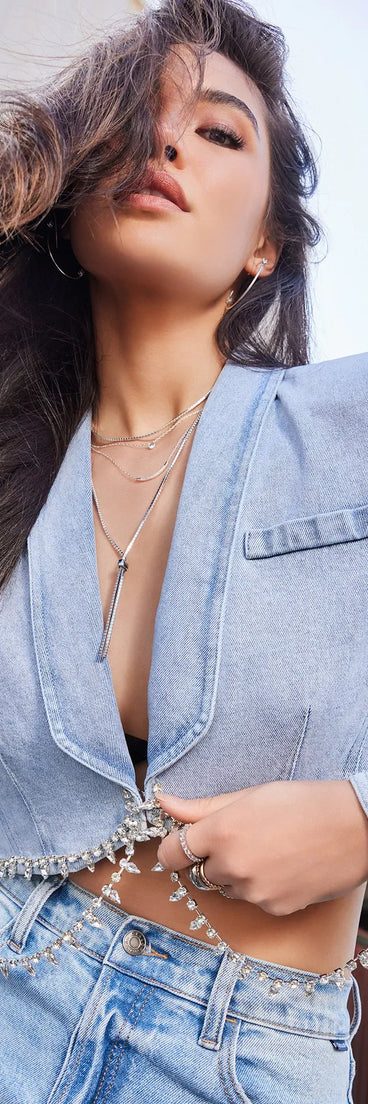 Complete your outfits with the Oh So Icy Rhinestone Trim Crop Denim Blazer, a light blue fashion jacket that adds stylish edge and versatile appeal.