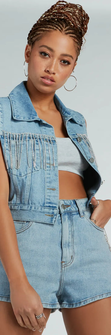 The Country Glamour Rhinestone Fringe Denim Vest has a sleek denim wash and the latest accents for a layer that instantly elevates your look.