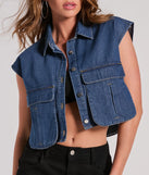 The Edgy Mood Pocket Oversized Crop Denim Vest in dark denim wash brings edge and energy to your vibe, ready to elevate any festival look or concert outfit.