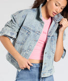 Stay on-trend this season with the Iconic Cutie Bow Trucker Denim Jacket in light blue, a must-have for creating stylish and effortless spring outfits for women.