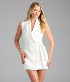 Step into summer looking effortlessly chic in the Sophisticated Vibe Double-Breasted Longline Vest in ivory, a must-have Windsor dress for your warm-weather wardrobe.
