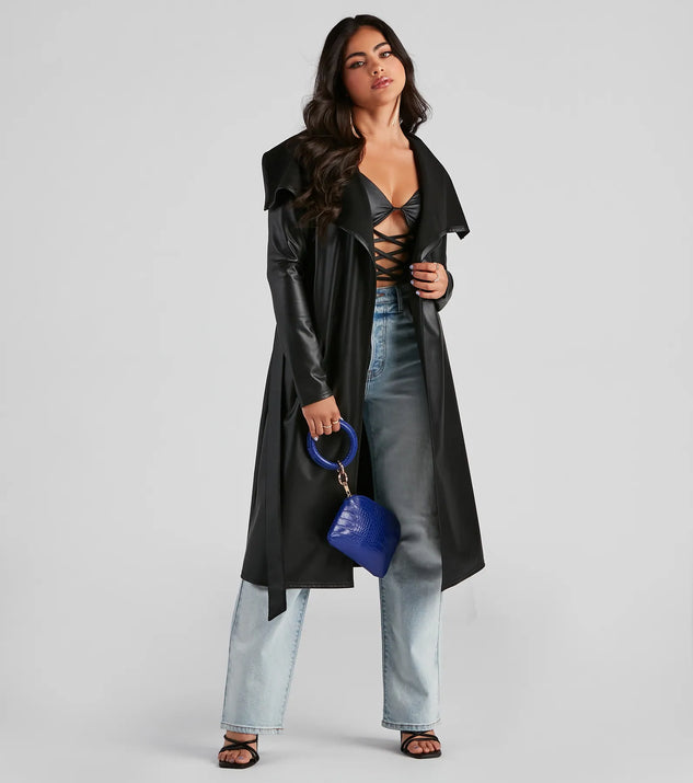 Stay chic this winter with Elevated And Chic Faux Leather Trench, a black women's coat perfect for layering. Featuring textured fabric and a trendy fit, this lightweight coat for women transitions effortlessly from cozy everyday wear to formal evening events.
