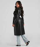 The Elevated And Chic Faux Leather Trench in black is a women's workwear piece offering a trendy style and unique accents, perfect for effortlessly creating an outfit-of-the-day look that transitions your office look to going-out ready.