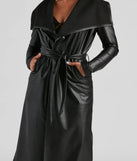 The Elevated And Chic Faux Leather Trench in black is a women's workwear piece offering a trendy style and unique accents, perfect for effortlessly creating an outfit-of-the-day look that transitions your office look to going-out ready.