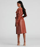 The Elevated And Chic Faux Leather Trench in brown is a women's workwear piece offering a trendy style and unique accents, perfect for effortlessly creating an outfit-of-the-day look that transitions your office look to going-out ready.