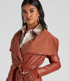 The Elevated And Chic Faux Leather Trench in brown is a women's workwear piece offering a trendy style and unique accents, perfect for effortlessly creating an outfit-of-the-day look that transitions your office look to going-out ready.