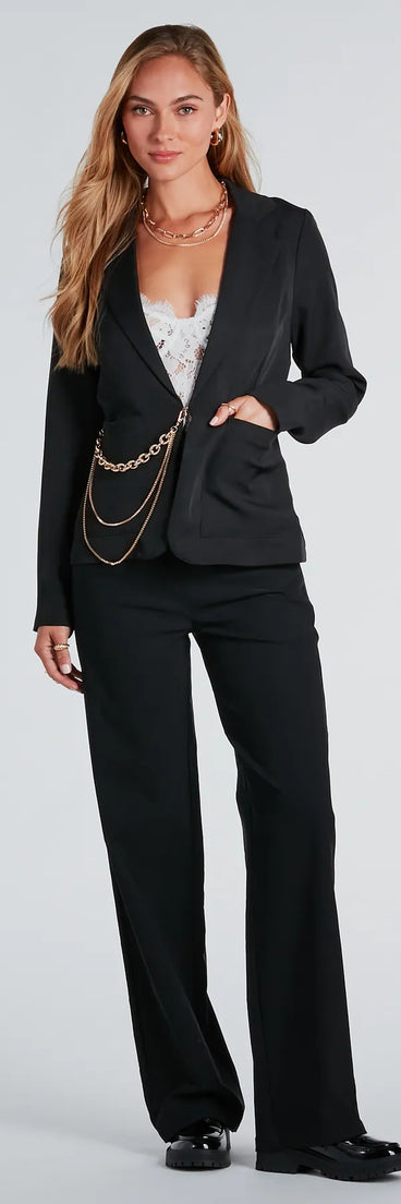 The Bling It On Crepe Blazer With Chain in black is a women's workwear essential with an elevated fabric and chic silhouette, ideal for layering and versatile enough to take your look from office chic to going-out ready!