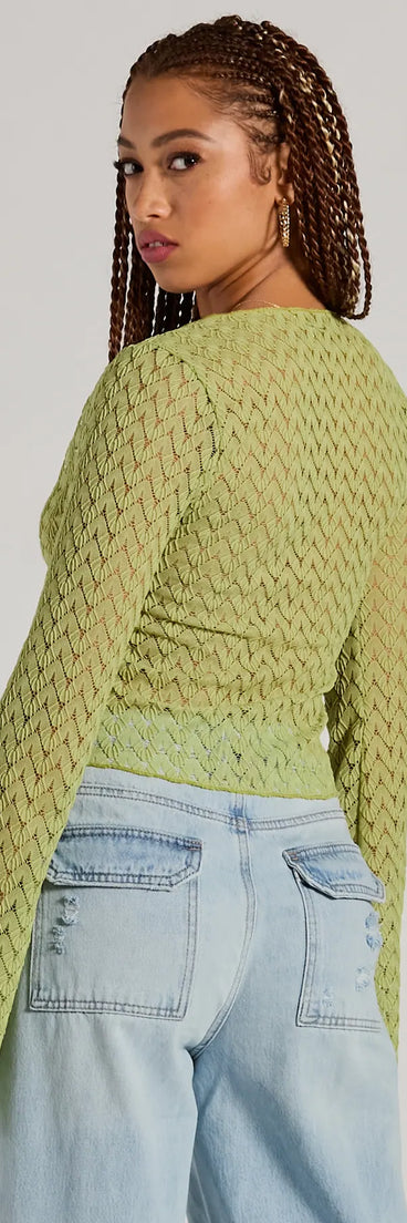 Layer-friendly Cabana Honey Tie Front Crochet Crop Sweater is a chic, transitional lime green long-sleeve top with contemporary sleeves and neckline design, ideal for an elevated seasonal style or casual elegance.