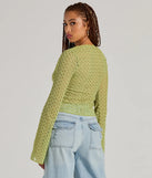 Layer-friendly Cabana Honey Tie Front Crochet Crop Sweater is a chic, transitional lime green long-sleeve top with contemporary sleeves and neckline design, ideal for an elevated seasonal style or casual elegance.