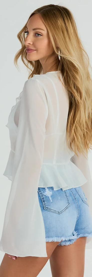 The Finding Inspiration Ruffled Tie Front Chiffon Top is a women's ivory long-sleeve top with an elevated style and unique design accents, perfect for layering or transitioning into colder months.