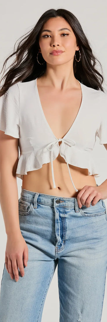 The Sweeten Me Up Flutter Sleeve Tie Front Crop Top in ivory with a modern design and trendy look is part of the latest women's tops collection to elevate your 2025 wardrobe.