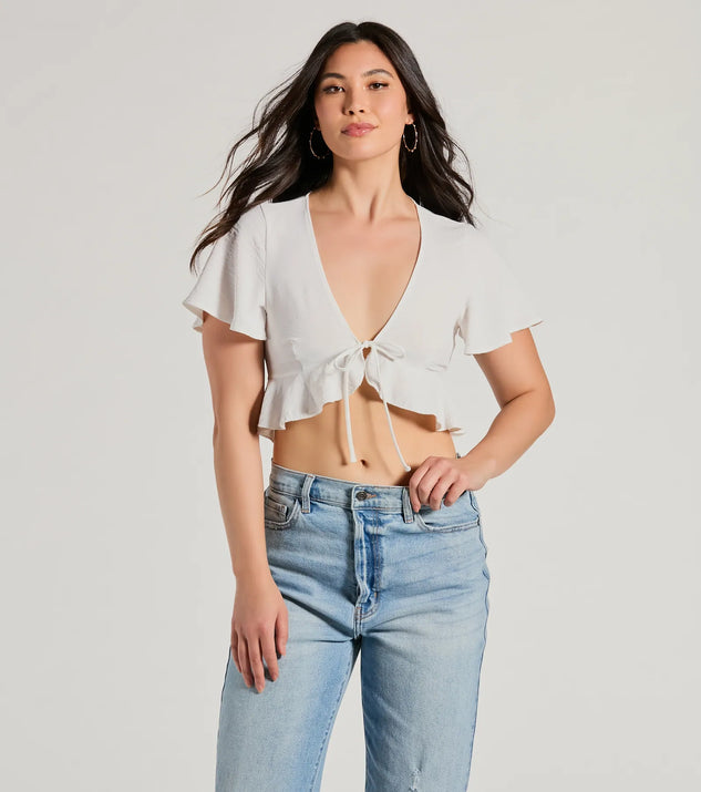 The Sweeten Me Up Flutter Sleeve Tie Front Crop Top in ivory with a modern design and trendy look is part of the latest women's tops collection to elevate your 2025 wardrobe.