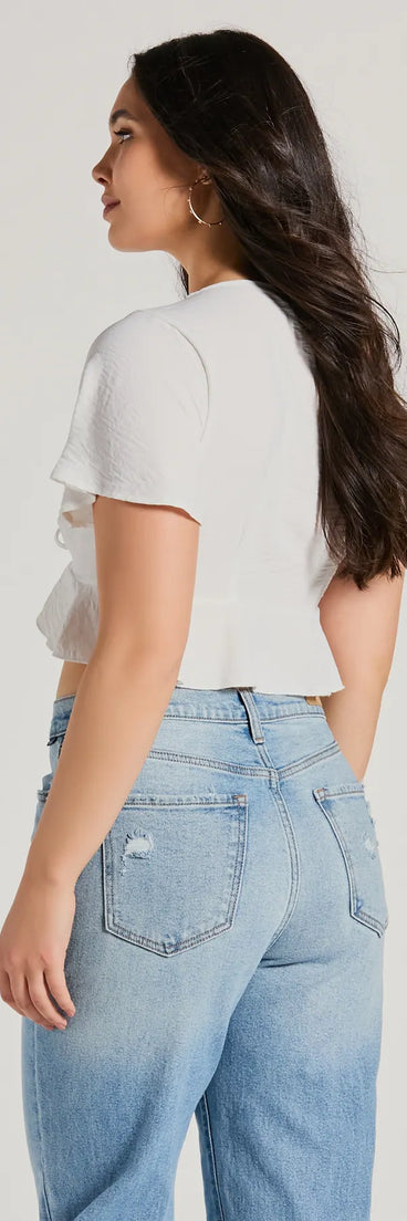 With its midriff cut and trend-forward fit, the Sweeten Me Up Flutter Sleeve Tie Front Crop Top is a ivory crop top made to pair with skirts, denim, or whatever vibe you're feeling this season.