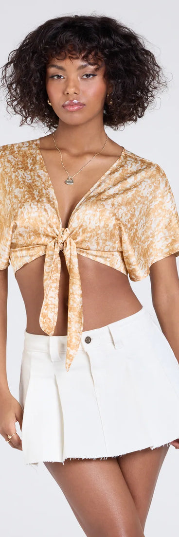 From bold to effortless, the Pretty Taste Tie-Front Printed Satin Top lets you define your vibe with peach tops that speak your style.