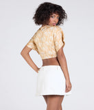 With its midriff cut and trend-forward fit, the Pretty Taste Tie-Front Printed Satin Top is a peach crop top made to pair with skirts, denim, or whatever vibe you're feeling this season.
