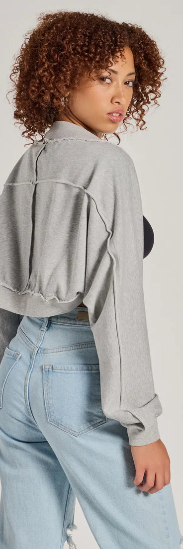 Wrap up in style with the The Essential Cotton Knit Long Sleeve Bolero, a cozy sweater for women designed for night-out looks, everyday outfits, or as a chic layering piece for cool evenings.