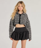 The Next Level Chic Houndstooth Woven Cropped Shacket in black is a women's workwear essential with an elevated fabric and chic silhouette, ideal for layering and versatile enough to take your look from office chic to going-out ready!