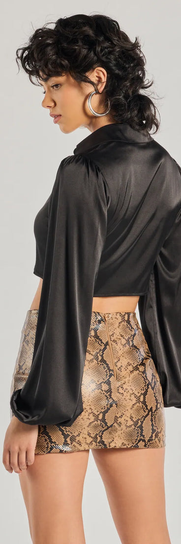 With its midriff cut and trend-forward fit, the Sleek Mood Satin Tie-Front Crop Top is a black crop top made to pair with skirts, denim, or whatever vibe you're feeling this season.