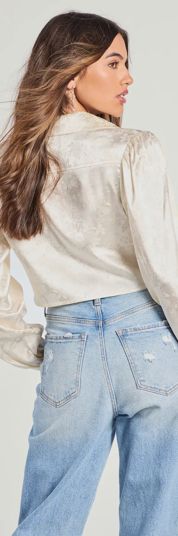 From bold to effortless, the Luxe Demure Tie-Front Satin Crop Top lets you define your vibe with ivory tops that speak your style.