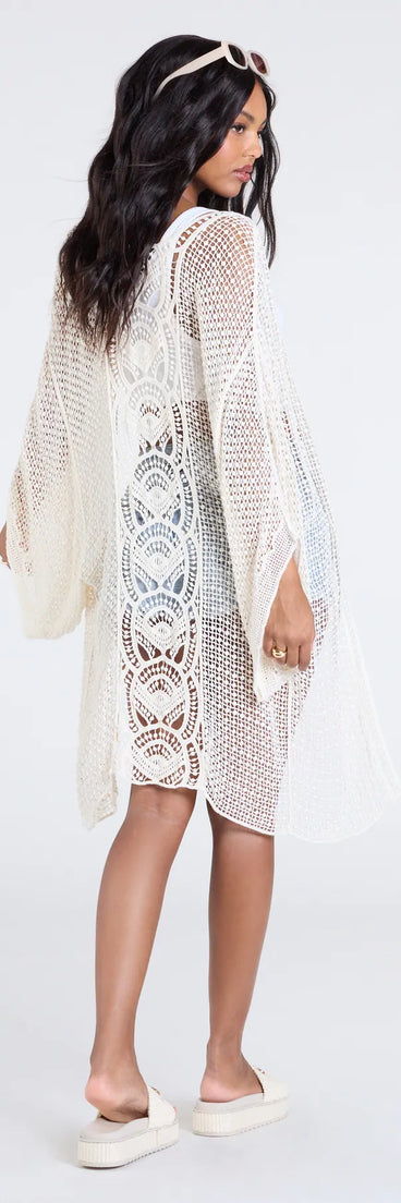 Stay on-trend this season with the Sun Seeker Sheer Crochet Kimono in natural, a must-have for creating stylish and effortless fall looks.