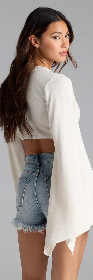 For college campus looks, game day outfits, or a bold going-out vibe, the Bring The Drama Bell Sleeve Tie Front Crop Top is an on-trend natural crop top that easily styles with your favorite denim.