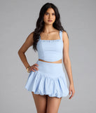 The Classy Cutie Poplin Bubble Mini Skirt in light blue features a short, flattering cut designed to elevate your look with just the right amount of edge.