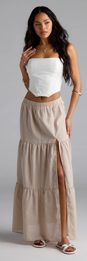 Upgrade your seasonal wardrobe with the Vintage Charm Gingham Slit Peasant Maxi Skirt, a trendy skirt in taupe made to mix, match, and stand out.