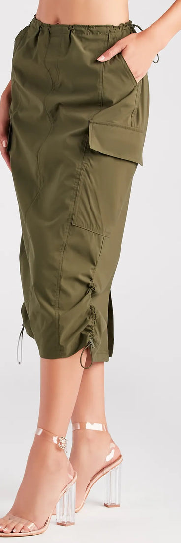 The She's A Trendsetter Nylon Parachute Midi Skirt is a olive cargo skirt, an effortlessly layer-friendly piece ideal for a holiday-ready look with a funtional-inspired flair.