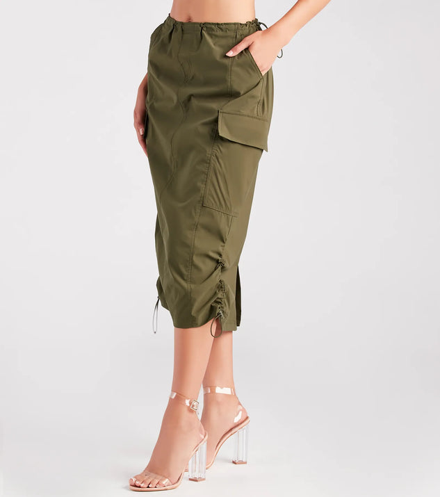 The She's A Trendsetter Nylon Parachute Midi Skirt is a olive cargo skirt, an effortlessly layer-friendly piece ideal for a holiday-ready look with a funtional-inspired flair.