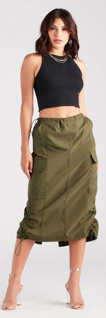 The She's A Trendsetter Nylon Parachute Midi Skirt in olive is a women's workwear piece offering a trendy style and unique accents, perfect for effortlessly creating an outfit-of-the-day look that transitions your office look to going-out ready.