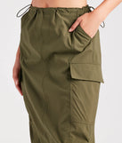 The She's A Trendsetter Nylon Parachute Midi Skirt in olive is a women's workwear piece offering a trendy style and unique accents, perfect for effortlessly creating an outfit-of-the-day look that transitions your office look to going-out ready.