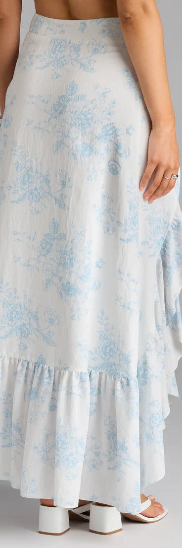 Designed for campus outfits, sleek workwear, and on-the-go moments, the Whimsical Essence Ruffled Floral Maxi Skirt is a trendy white bottom for women bringing effortless fall versatility.