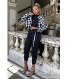 The Major Cutie Cargo Joggers is a trendy women's bottom in black, designed with modern details and alluring textures to complete chic outfits for 2025.