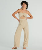 Step into seasonal style with the Coastal Cutie Halter Cutout Striped Linen Jumpsuit, a women's taupe jumpsuit in a rich winter color, ideal for creating chic holiday party attire or a night-out look.