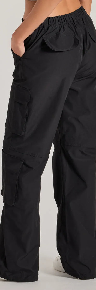 The Out For The Day High-Rise Cargo Pants is a trendy women's bottom in black, designed with modern details and alluring textures to complete chic outfits for 2026.