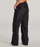 The Out For The Day High-Rise Cargo Pants is a trendy women's bottom in black, designed with modern details and alluring textures to complete chic outfits for 2025.